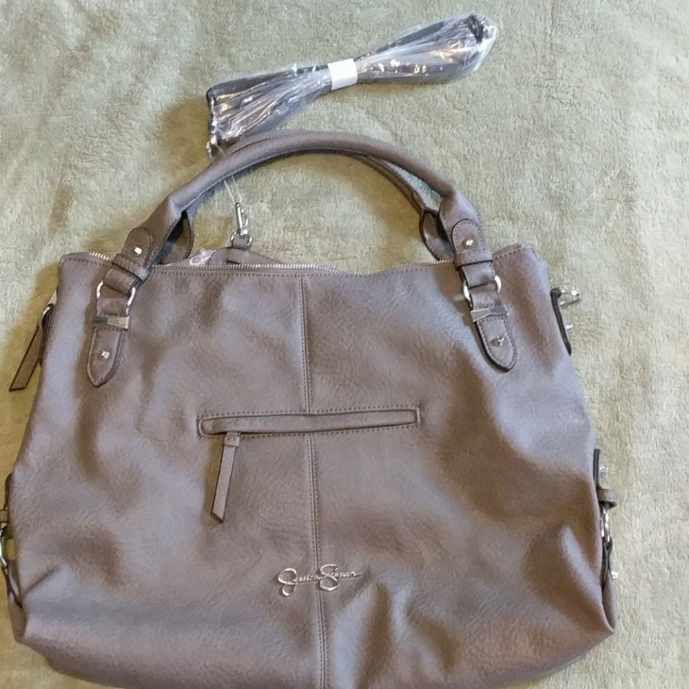 Brand new Jessica Simpson gray purse with strap